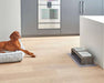 Bowsers Gourmet Placemat For Artisan Dog Feeder in a modern kitchen beneath a double elevated feeding station beside a resting brown dog
