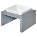 Bowsers Moderno Single Wood Feeder is pictured from a side perspective with a square white ceramic bowl atop a minimalist grey wooden base