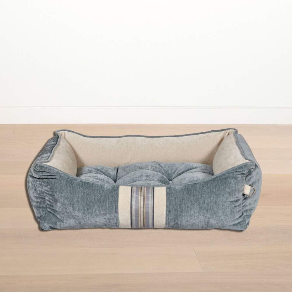 Bowsers One Of A Kind Scoop Dog Bed in mineral grey and beige on a wooden floor