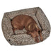 Brown dog sleeps curled up inside a square leopard-print Bowsers The Franklin Dog Bed