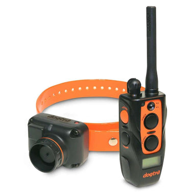 Close-up of Dogtra 2700T&B Training and Beeper 1 Mile Dog Remote Trainer shows the handheld remote and orange collar with the attached beeper device