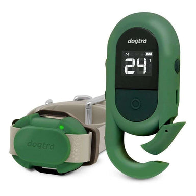 Close-up shows the green remote and collar of Dogtra CUE 400 Yard Dog Remote Trainer with a digital screen and adjustable settings