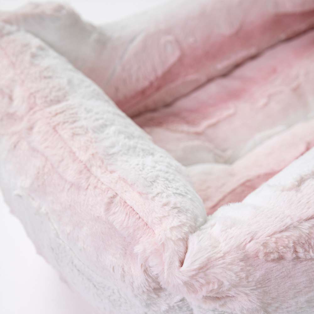 Close-up of a pink Hello Doggie Cashmere Dog Bed, highlighting the soft, luxurious texture and elegant design