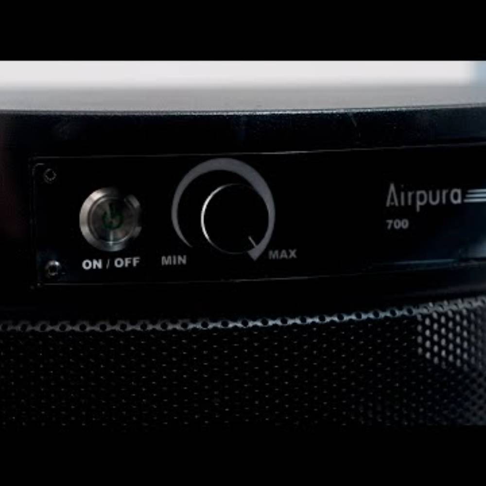 Close-up of the control panel on the Airpura T600 DLX - Heavy Tobacco Smoke Air Purifier, showing the power button and adjustment dial for airflow