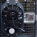 Dakota 283 Dog Crate Ventilation Fan mounted on the outside of a crate door, with a protective grille covering the spinning fan