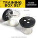 Dogtra 3 Ball Training Boxes & 3 Scent Cans shows clear glass scent containers with black plastic lids that have three round scent holes on top