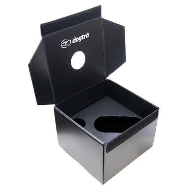 Dogtra Ball Training Box Only 3 Count is shown as an open black plastic training box with a hinged lid, round and oval cutouts, and the Dogtra logo printed in white on the inside panel