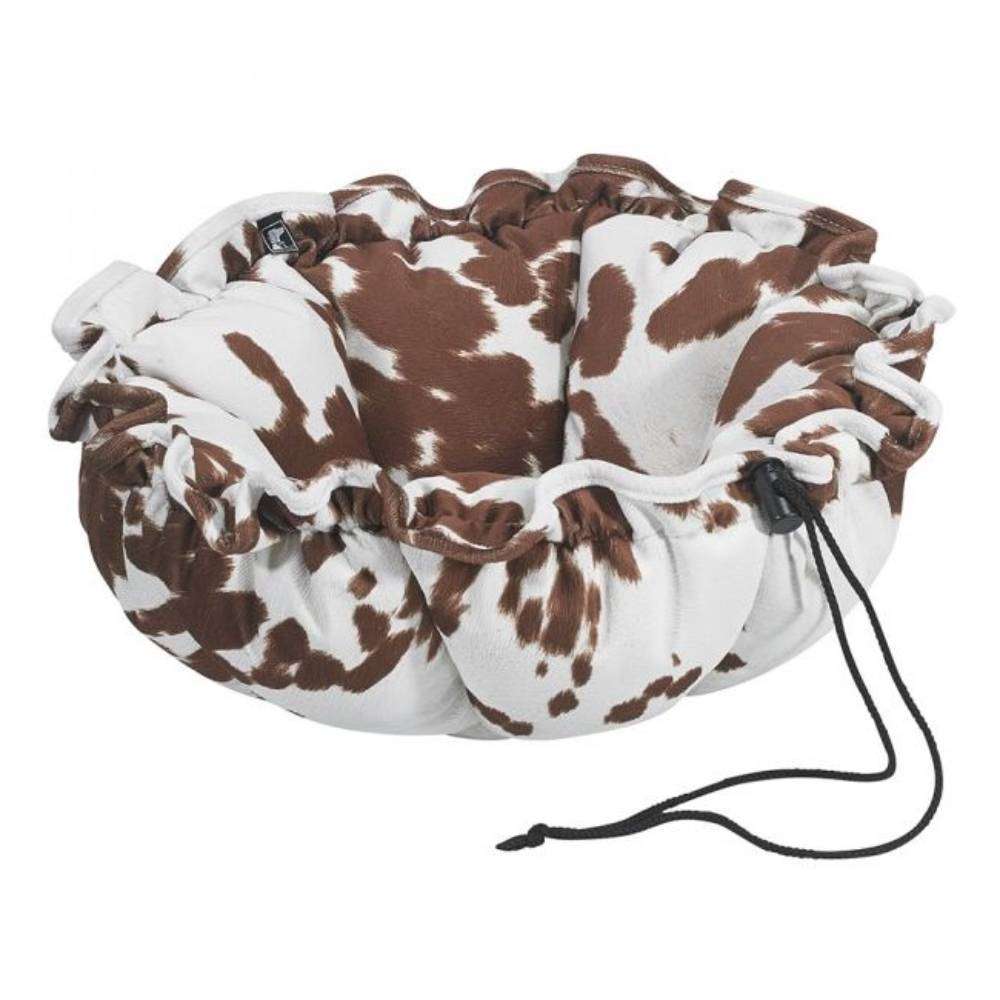 Durango Bowsers Buttercup Dog Bed featuring a brown and white cow-print design with cushioned circular bolsters