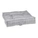 Glacier Bowsers Piazza Dog Bed in light gray textured fabric features a plush tufted cushion with thick padded edges for cozy comfort