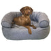 Gravel Bowsers Double Donut Bed with a cozy gray cushioned design shown with a brown puppy relaxing inside