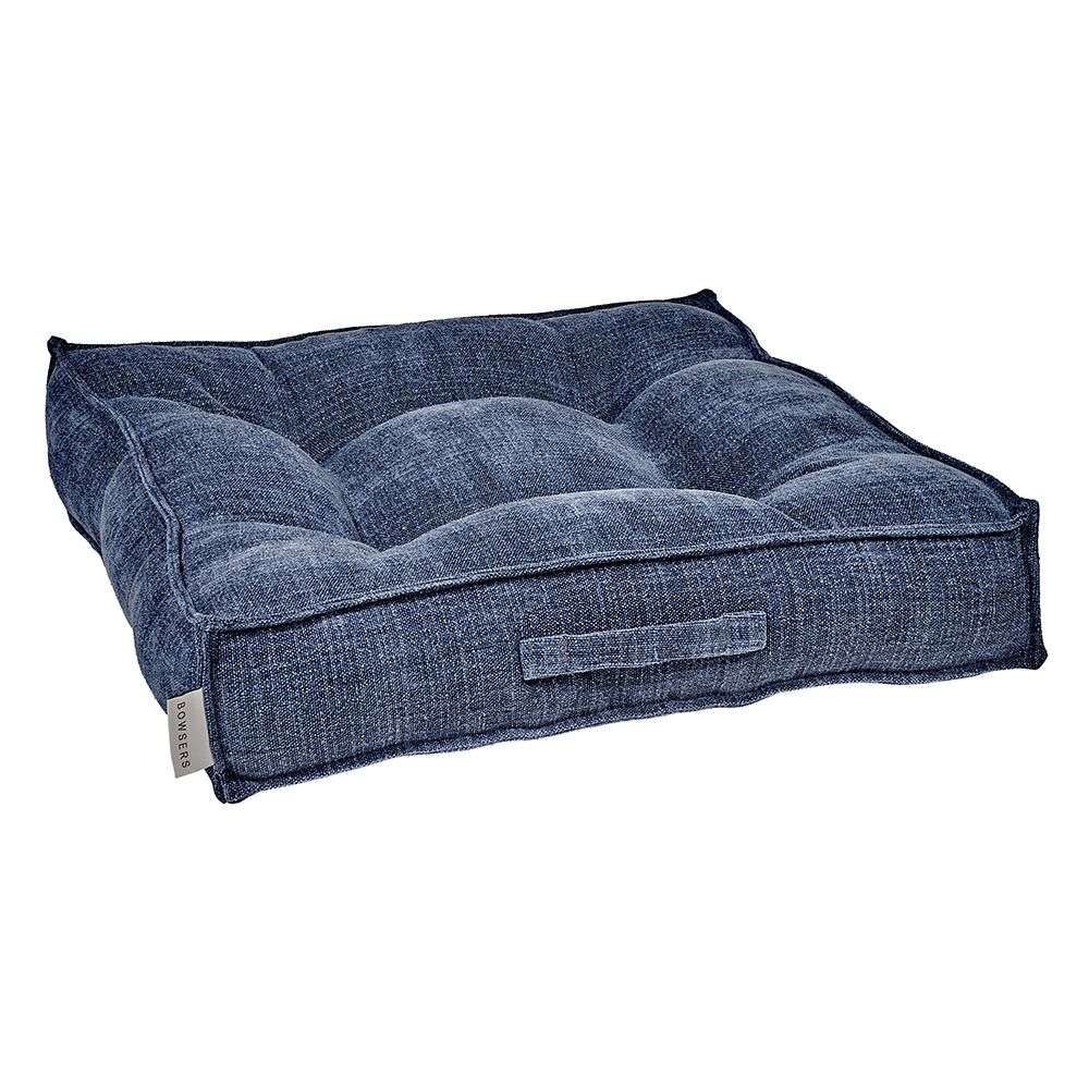 Indigo Bowsers Piazza Dog Bed in deep blue woven fabric offers a soft tufted center with supportive raised bolsters for pets