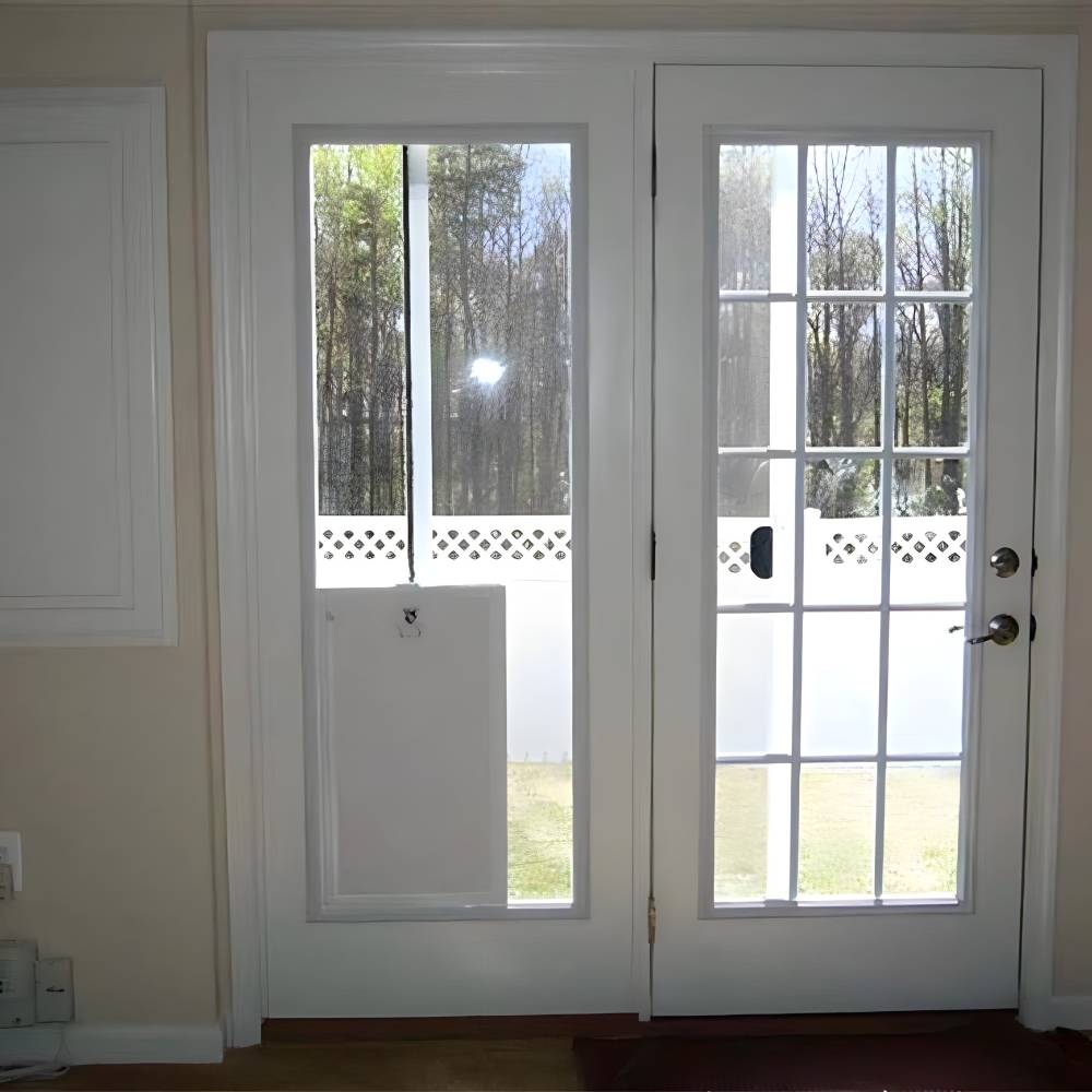 Interior view of the Security Boss MaxSeal In-Glass Dog Door installed in a French door, seamlessly blending into the home's interior while providing easy access for pets