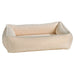Ivory Sheepskin Bowsers Urban Lounger Dog Bed in cream plush fabric with cozy raised edges