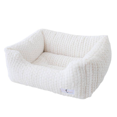 Ivory-colored Hello Doggie Paris Dog Bed featuring a plush, textured design with high sides and a soft, cushioned interior