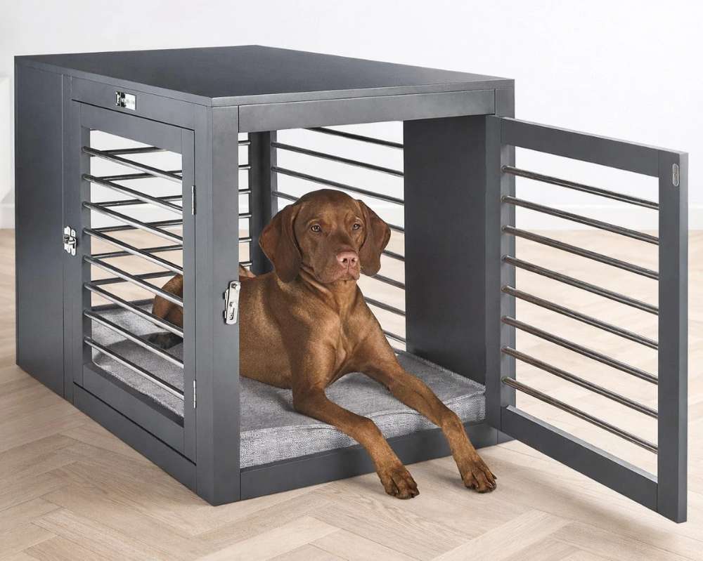 Large brown dog lies inside a dark gray modern pet crate on Bowsers Moderno & Fresco Dog Crate Mat with a soft gray cushioned surface