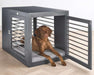 Large brown dog lies inside a dark gray modern pet crate on Bowsers Moderno & Fresco Dog Crate Mat with a soft gray cushioned surface