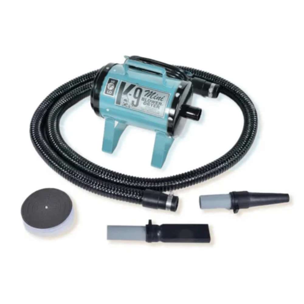 Light Blue K-9 Mini Dog Dryer is a small grooming dryer with a pale blue body, black hose, and detachable nozzle tools for pets