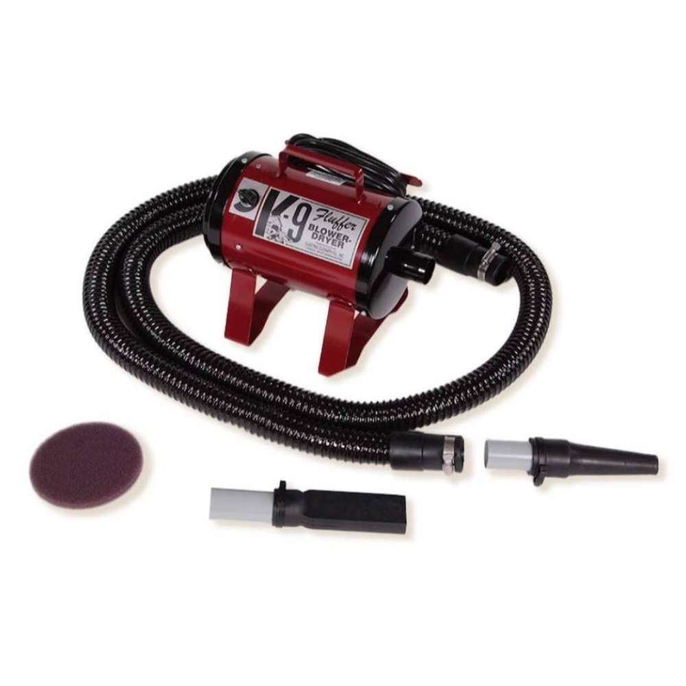 Maroon K-9 Fluffer Dryer with a black hose and interchangeable grooming nozzles is displayed for pet grooming tasks
