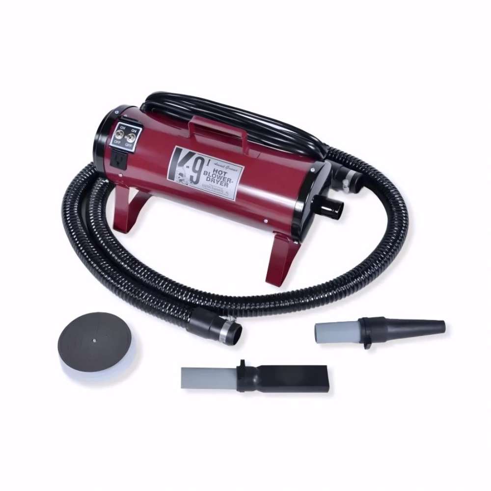 Maroon K-9 I Dog Dryer with a black hose and detachable nozzle accessories is arranged neatly on a white surface