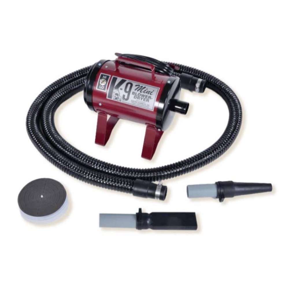 Maroon K-9 Mini Dog Dryer is a compact burgundy-colored pet grooming dryer equipped with a hose, nozzle attachments, and filter cover