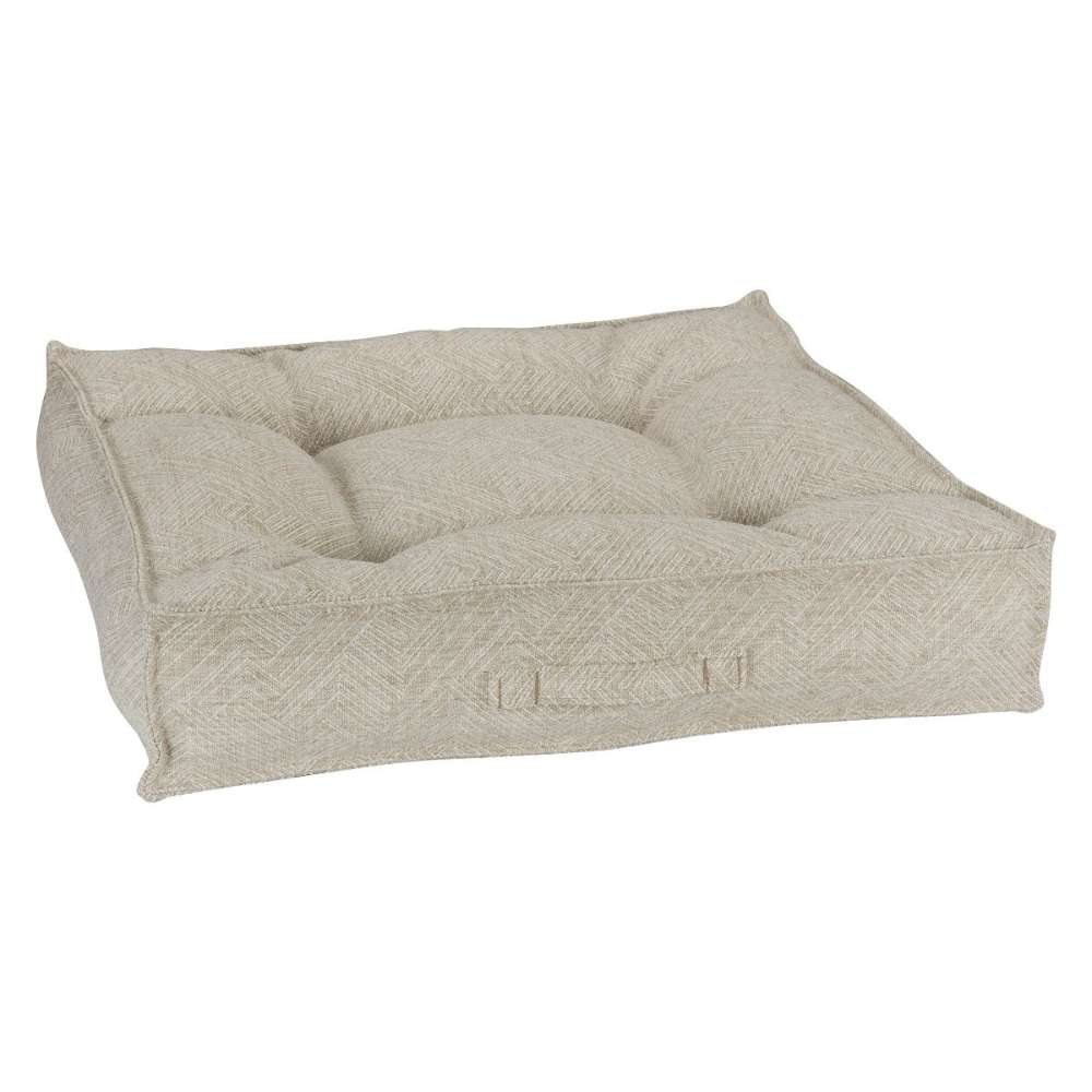 Natura Bowsers Piazza Dog Bed in soft beige herringbone fabric features a plush tufted cushion with supportive padded edges