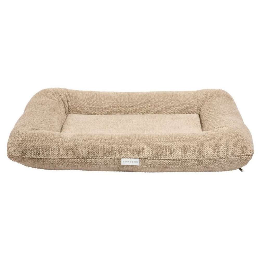 Oatmeal Bowsers Hugo Futon Dog Bed features a tan textured fabric with raised bolsters and a soft padded center