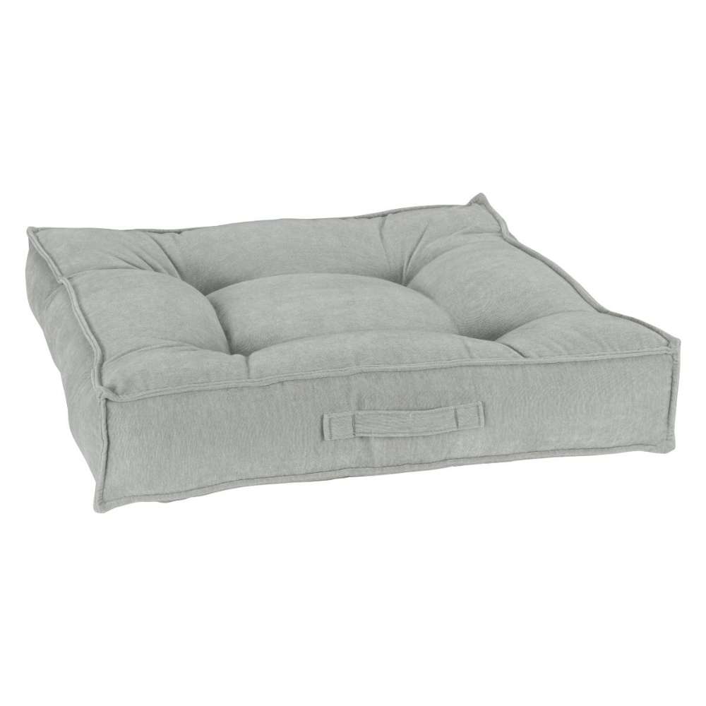 Oyster Bowsers Piazza Dog Bed in light gray fabric offers a cozy tufted center with thick cushioned bolsters for pets