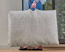 Person carries a large beige Bowsers Avenue Dog Bed with a built-in handle, showing its portable and lightweight design