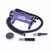 Purple K-9 I Dog Dryer with a coiled black hose and two nozzle tips is shown against a simple white backdrop