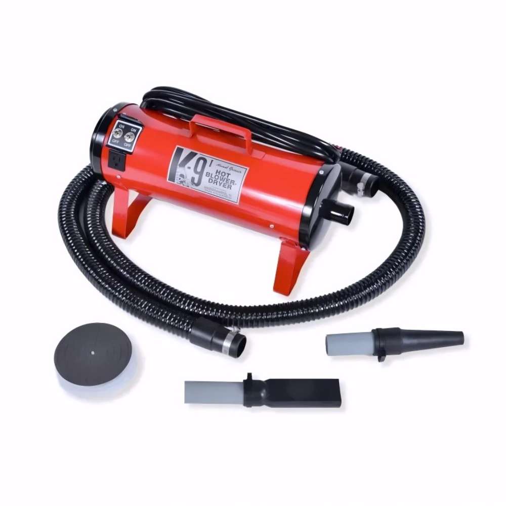 Red K-9 I Dog Dryer with a black hose and grooming attachments is presented on a plain white background