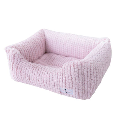 Rosewater pink Hello Doggie Paris Dog Bed showcasing a luxurious, knitted appearance with raised edges and a cozy, padded base