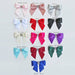 Selection of satin bows available for the Hello Doggie Enchanted Nights Dog Bed, displayed in various colors