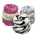 Several stacked Bowsers The Muffy Dog Bed in fluffy fabrics, including striped and solid designs