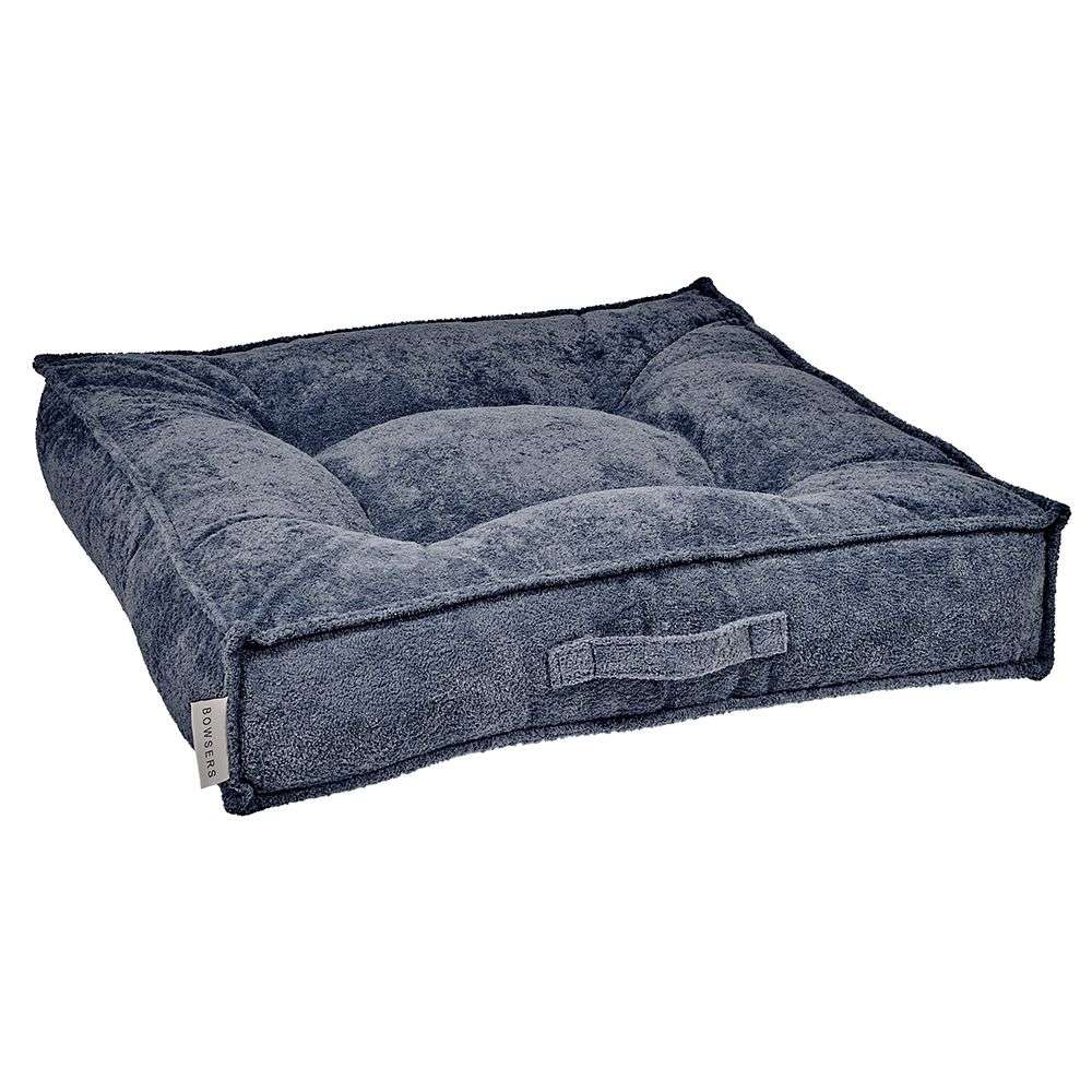 Stormberry Bowsers Piazza Dog Bed in dark blue plush fabric features a soft tufted cushion with thick cozy bolsters