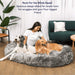 The Charcoal Grey Paw PupCloud™ Human-Size Faux Fur Memory Foam Dog Bed offers ample room for a woman and her two dogs to snuggle together comfortably