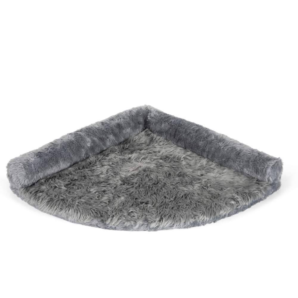 The Charcoal Grey Paw PupRug™ Memory Foam Corner Dog Bed is shown empty, placed neatly in a corner