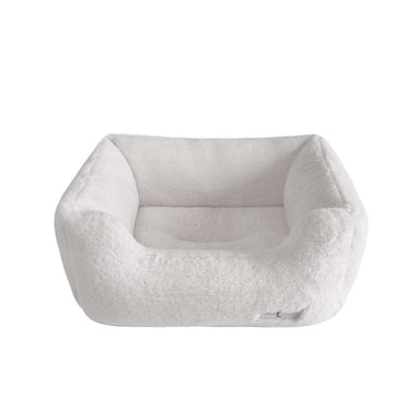 The Hello Doggie Baby Dog Bed in Natural with its neutral color and plush texture