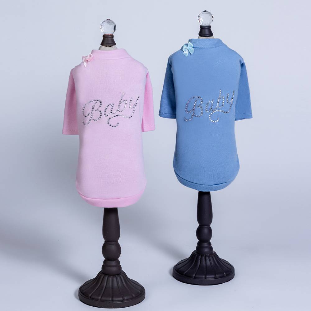 The Hello Doggie Baby Dog Tee comes in both blue and pink colors, each adorned with a bow and rhinestones spelling Baby on the back