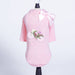 The Hello Doggie Bicycle Dog Sweater is shown on a display stand, highlighting its soft pink color and intricate bicycle embroidery with a bow at the neckline