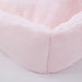The Hello Doggie Big Baby Bed in ice pink features a delicate, pastel hue with a fluffy, velvety texture