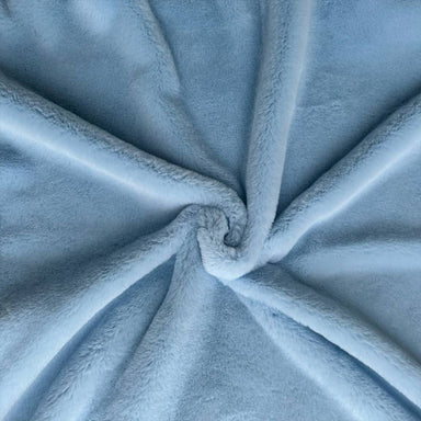 The Hello Doggie Big Baby Dog Blanket in baby blue features a smooth, light blue fabric twisted into an elegant knot for texture display