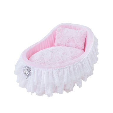 The Hello Doggie Crib Dog Bed in pink, designed with a charming cradle shape, soft pink fabric, and delicate white lace ruffles, completed with a sparkling brooch