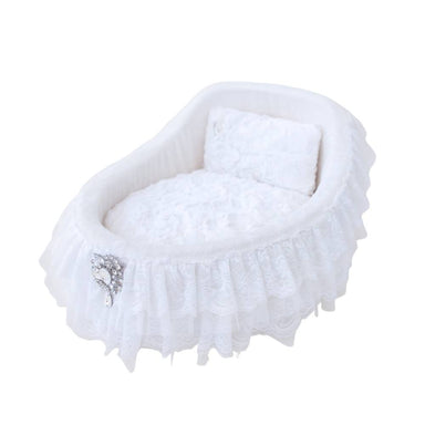 The Hello Doggie Crib Dog Bed in white, highlighting a plush, cushioned interior with delicate lace ruffles and an elegant brooch