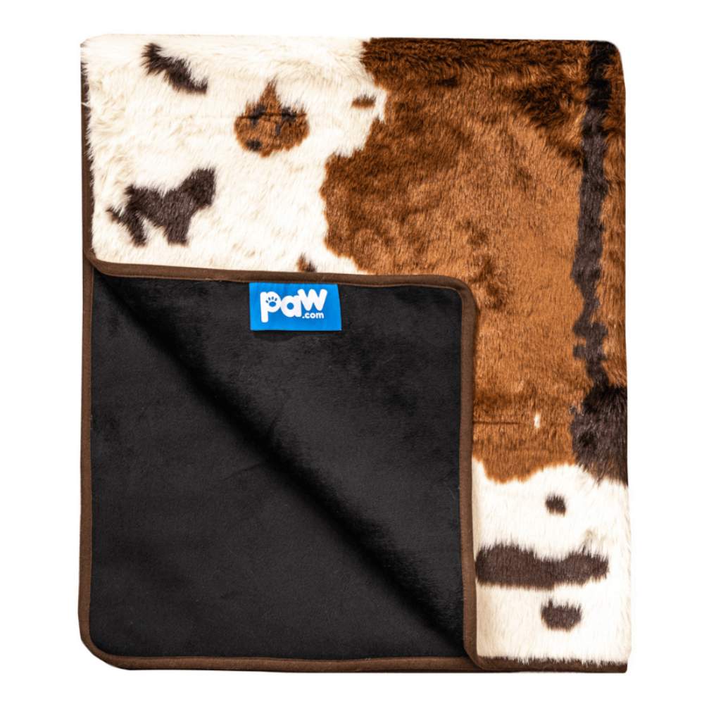 The Paw PupProtector™ Waterproof Throw Blanket - Brown Faux Cowhide is shown folded to reveal its black underside