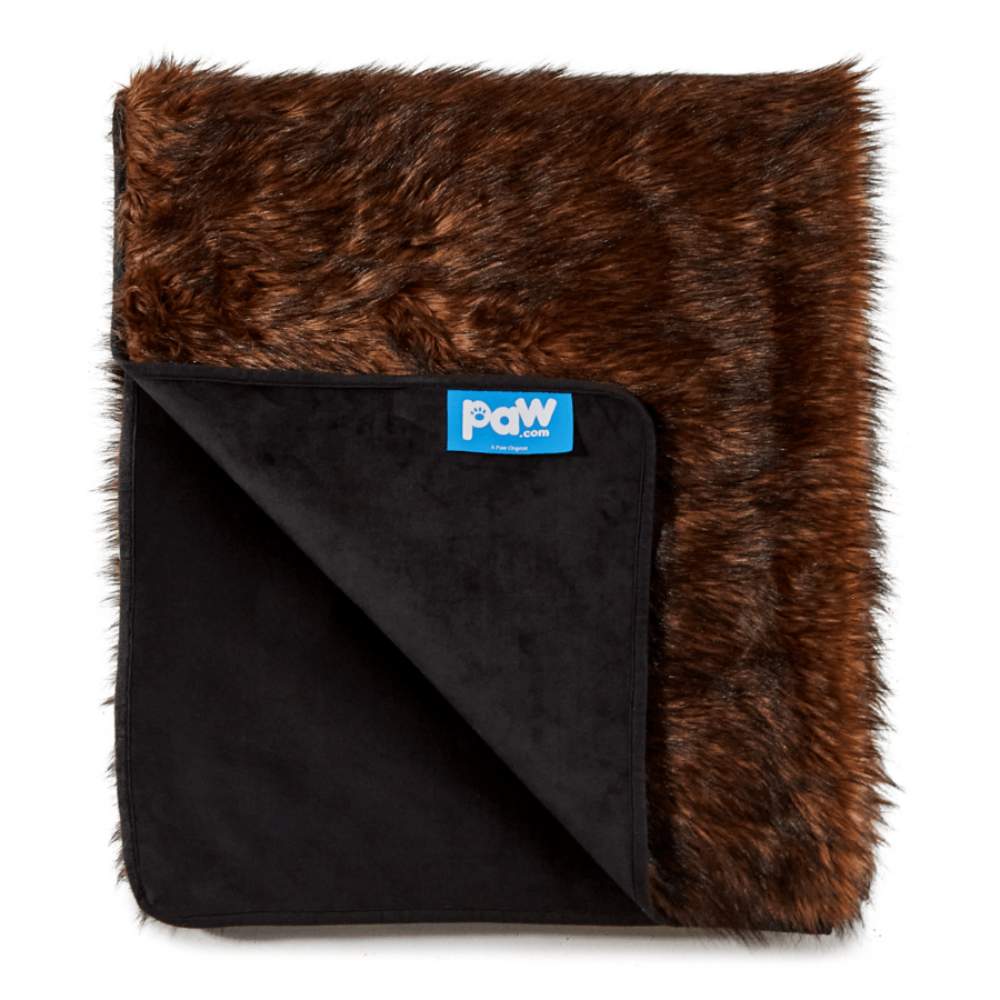 The Paw PupProtector™ Waterproof Throw Blanket - Brown is displayed folded, showing its soft texture and label