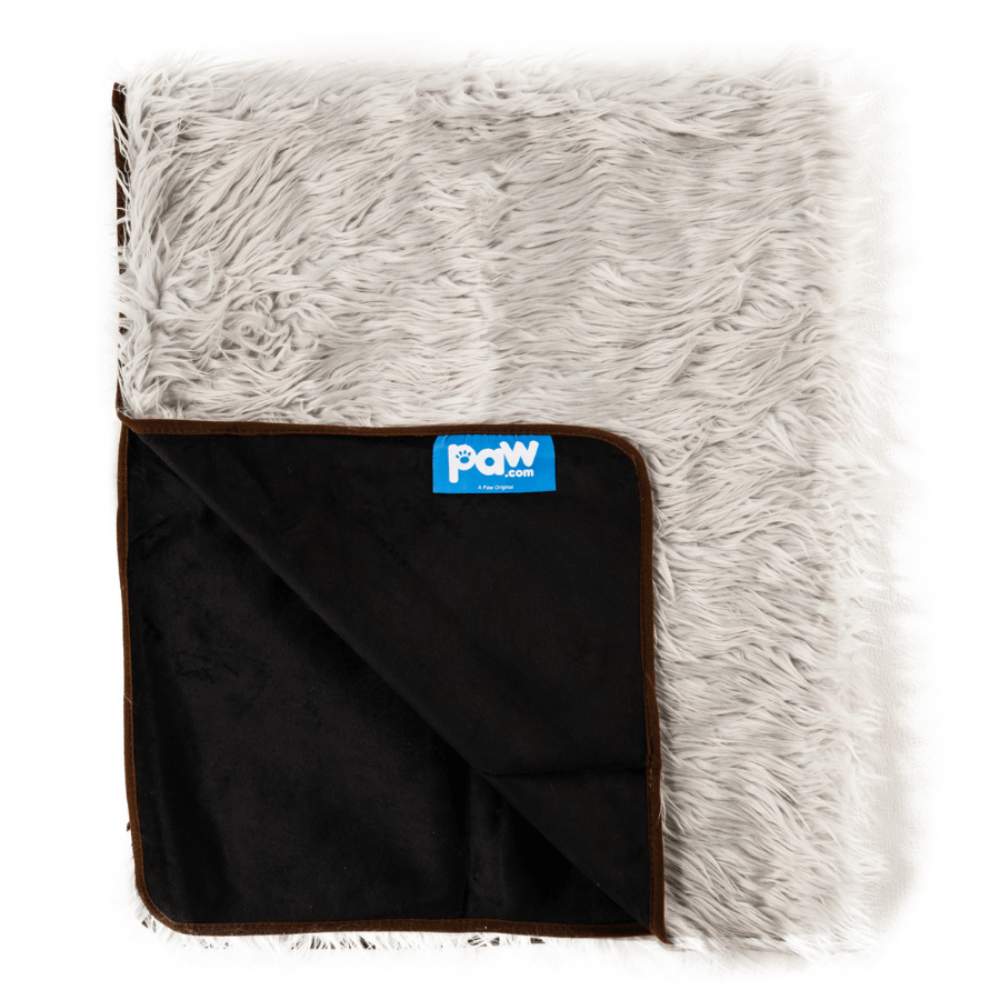 The Paw PupProtector™ Waterproof Throw Blanket - Grey is shown folded to reveal its black underside