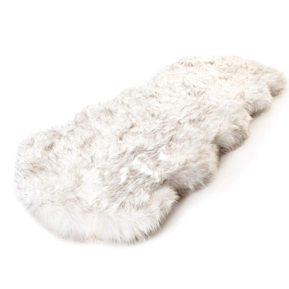 The Paw PupRug™ Runner Faux Fur Memory Foam Dog Bed Curve White with Brown Accents displayed on its own, showcasing its plush texture