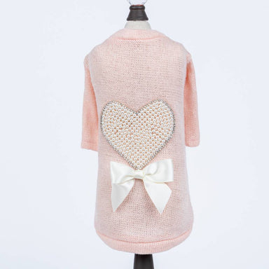 The back view of the Hello Doggie Pearl Heart Dog Sweater in peach color shows the full heart and bow design, highlighting its elegant detailing
