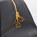 The close-up image highlights the gold-tone zipper pulls of the Hello Doggie Grand Voyager Dog Carrier, each adorned with a stylish D logo