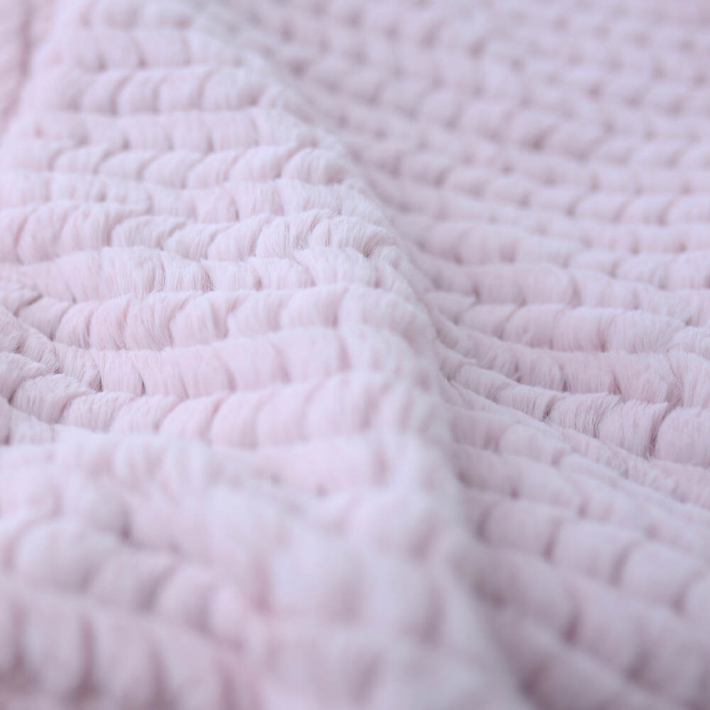The close-up image reveals the delicate weave and plushness of the Hello Doggie Paris Dog Blanket in rosewater